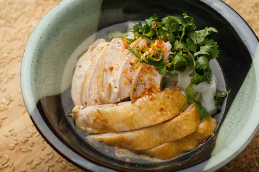 Hainan chicken noodle: pulled chicken over small rice noodle with chili sauce