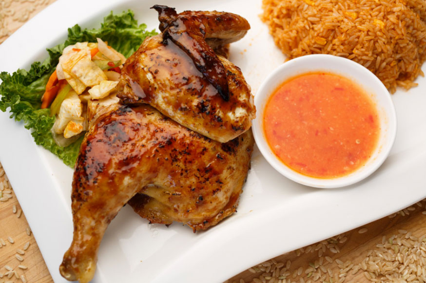 Roasted lemongrass half chicken with fried egg and tomato rice